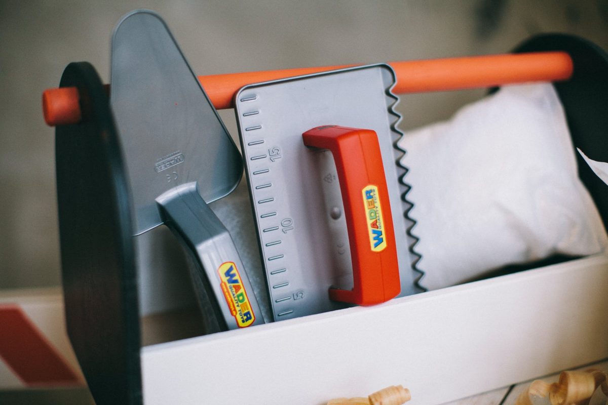 a plastic tool box with tools toy
